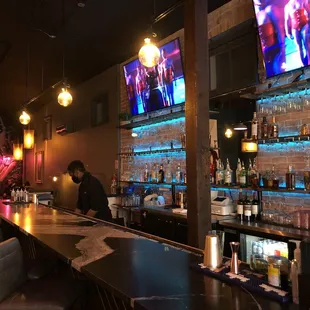 a bar with a man at the bar