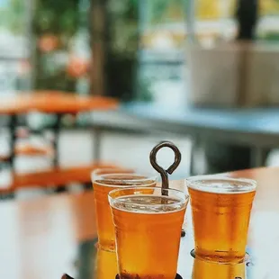 two glasses of beer on a tray