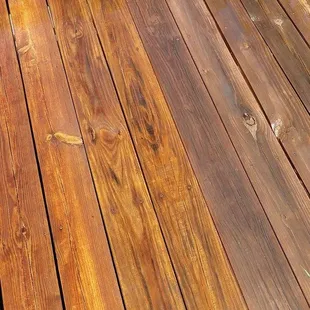 a shadow of a person on a deck