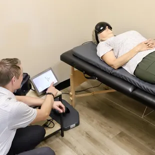 Wichita chiropractor monitoring patient