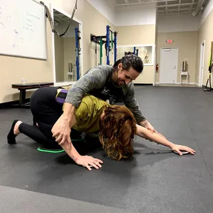 physical therapist helping patient