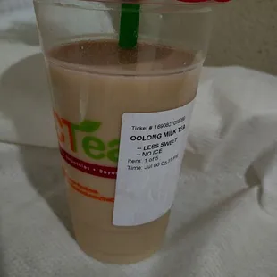 a cup of iced coffee with a straw