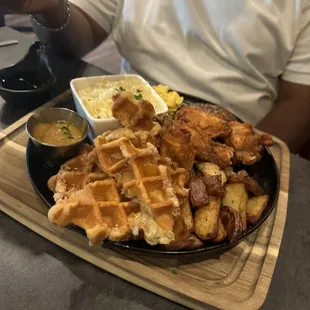 Waffles, chicken, fried potatoes and cheese grits... excellent