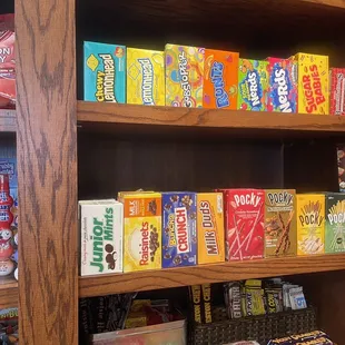 a shelf full of snacks and candy