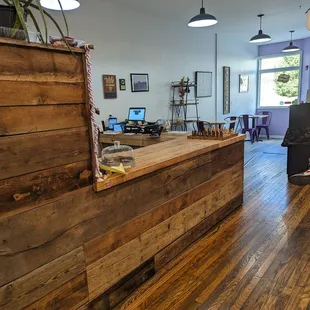 a wooden counter with a laptop on it