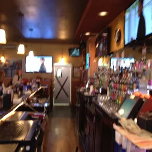 a view of the bar from the back of the room