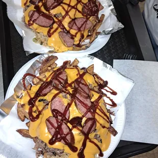 two plates of nachos