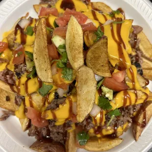 Big VELT!!! Loaded potato wedges topped w/ brisket, cheese, &amp; Pico!