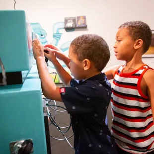 Let the kids tinker at Robo Art, showing now through Jan. 2, 2022.