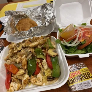 Chicken kabob dinner. Includes side salad, your choice rice or fries. Here got rice.