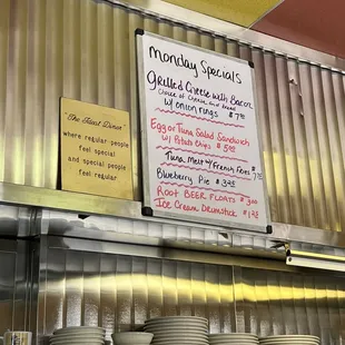 a menu on the wall of a restaurant