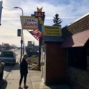 a woman walking down the sidewalk