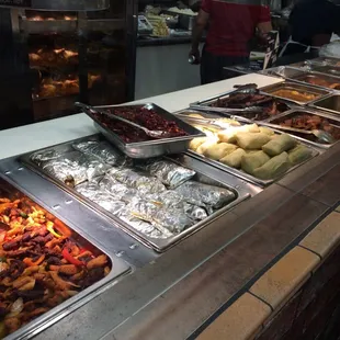 a variety of food in a buffet