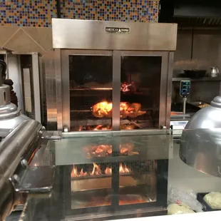 a large oven with food cooking in it