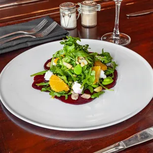 a plate of food on a wooden table