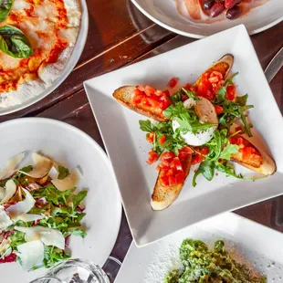 a variety of dishes of food on a table