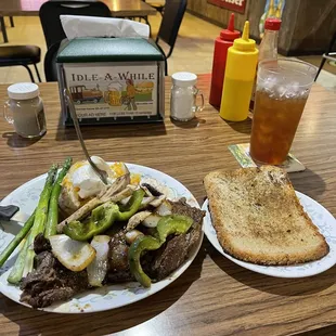 ows two plates of food on a table