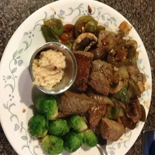 ows a plate of food on a table