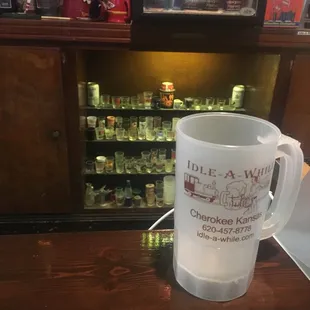 ows a coffee mug sitting on a bar
