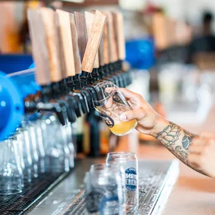 a bartender pouring a drink