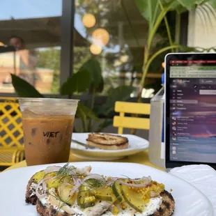 a plate of food and a laptop