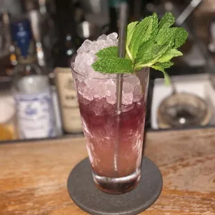a drink with ice and mint
