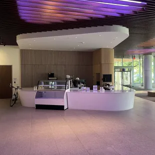 a coffee shop with purple lighting