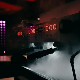 a coffee machine with steam coming out of it