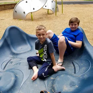 Boys in a giant fidget spinner!