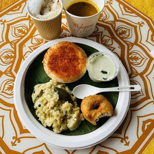 a plate of food and a cup of coffee