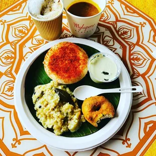 a plate of food and a cup of coffee
