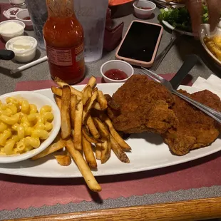 Pork Chop with Mac &apos;n&apos; Cheese and fries