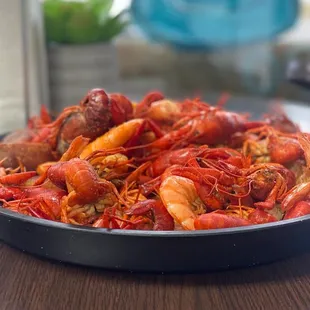 a plate of crawfish and shrimp