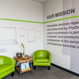 iFixOmaha Cass Court - comfy green chairs and mission statement in our lobby.