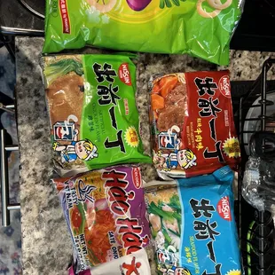 Different types of Ramen and onion rings snacks