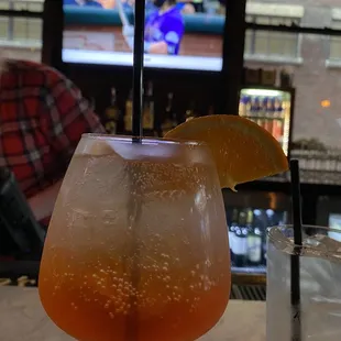a drink with a slice of lemon