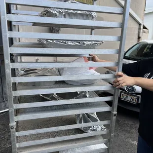 a man holding a tray of food