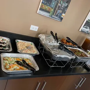 Uncovered pans-Andagi and shoyu pork.