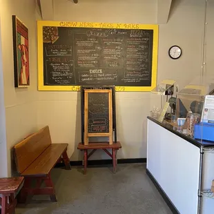 a coffee shop with a chalkboard on the wall