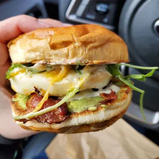 Brioche, egg, sauce, cheddar, bacon, avocado, arugula