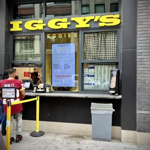 people standing in front of a store