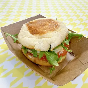 Iggycado - jammy egg, avocado, greens, tomato, iggy sauce on an English muffin