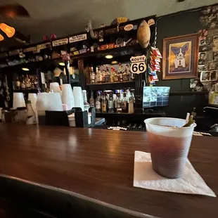 a drink on a napkin on a bar