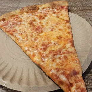 Plain slice. $3.75. Perfectly OK. A bit thinner than most. Cheese quality is alright. A tad greasy. More saucy than cheesy