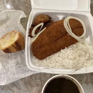 Fry fish dinner with white rice, sweet plantains, small buttered Cuban bread, and black bean
