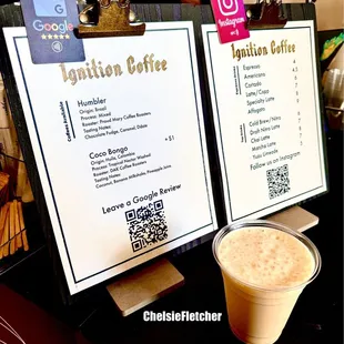 a drink and menu at a coffee shop