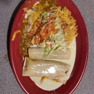 Tamale, enchilada, with rice and beans.