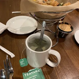 a cup of tea and a plate of food