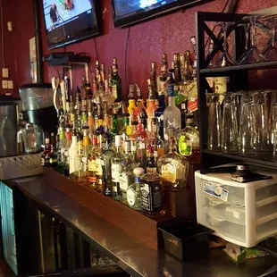 a bar with many bottles of liquor