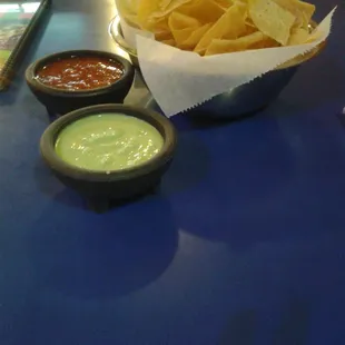 a bowl of chips and dips